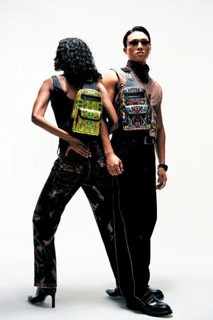 Two people wearing FETTI Kosmic Immersion noir sling bag on a white background