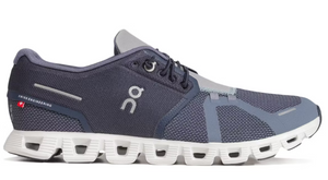 Navy and gray running shoe with white sole on a white background