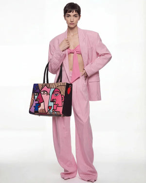 Close-up of FETTI Faces graphic print on tote bag