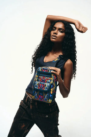 Woman wearing stylish black sling bag outdoors