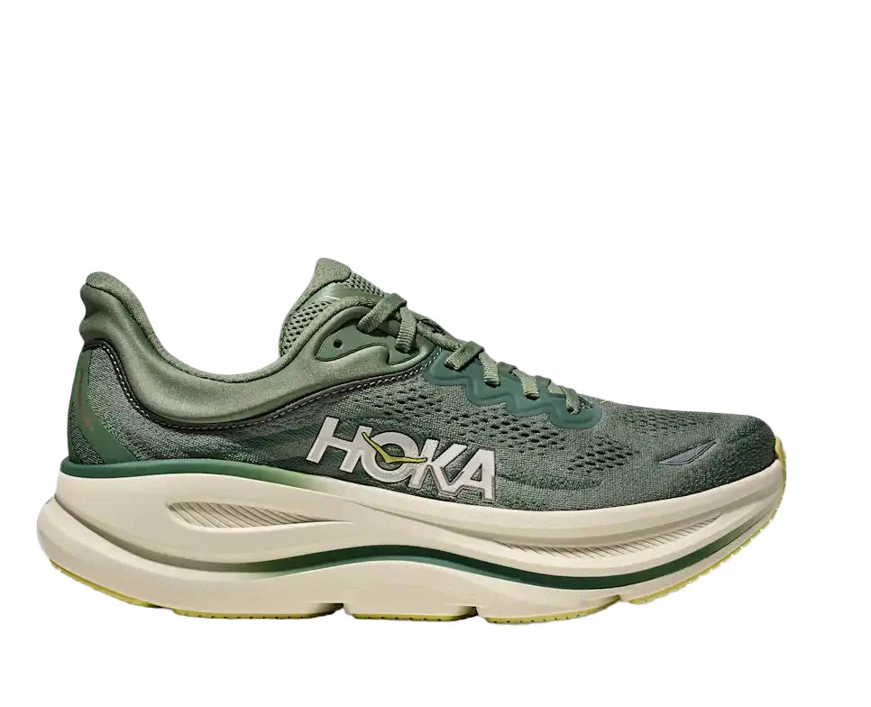 Green running shoe with 'Hoka' branding on a white background