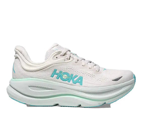 White running shoe with blue Hoka branding on a white background