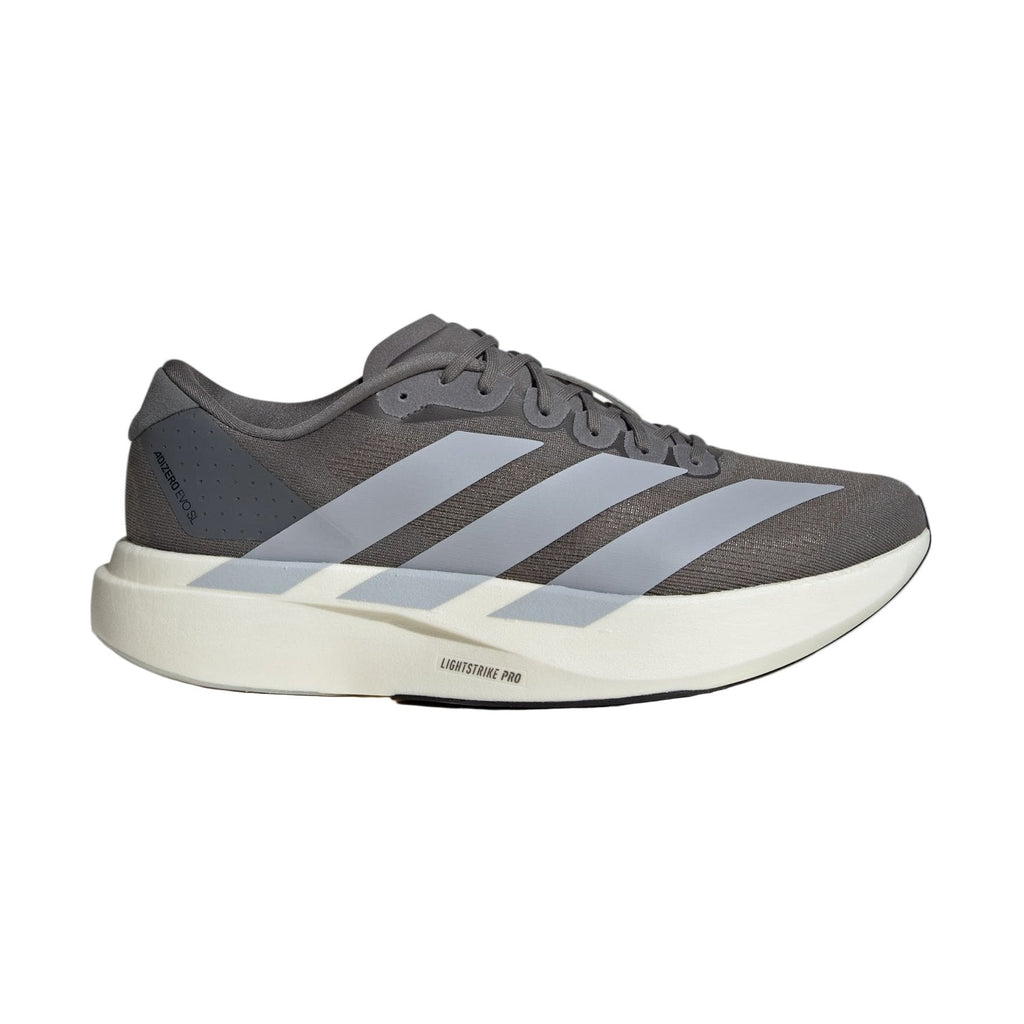 Gray Adidas running shoe with three stripes on a light gray background