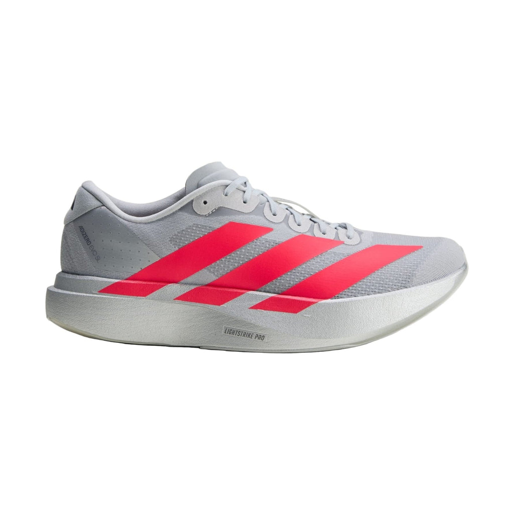 Gray Adidas running shoe with red stripes on a light gray background