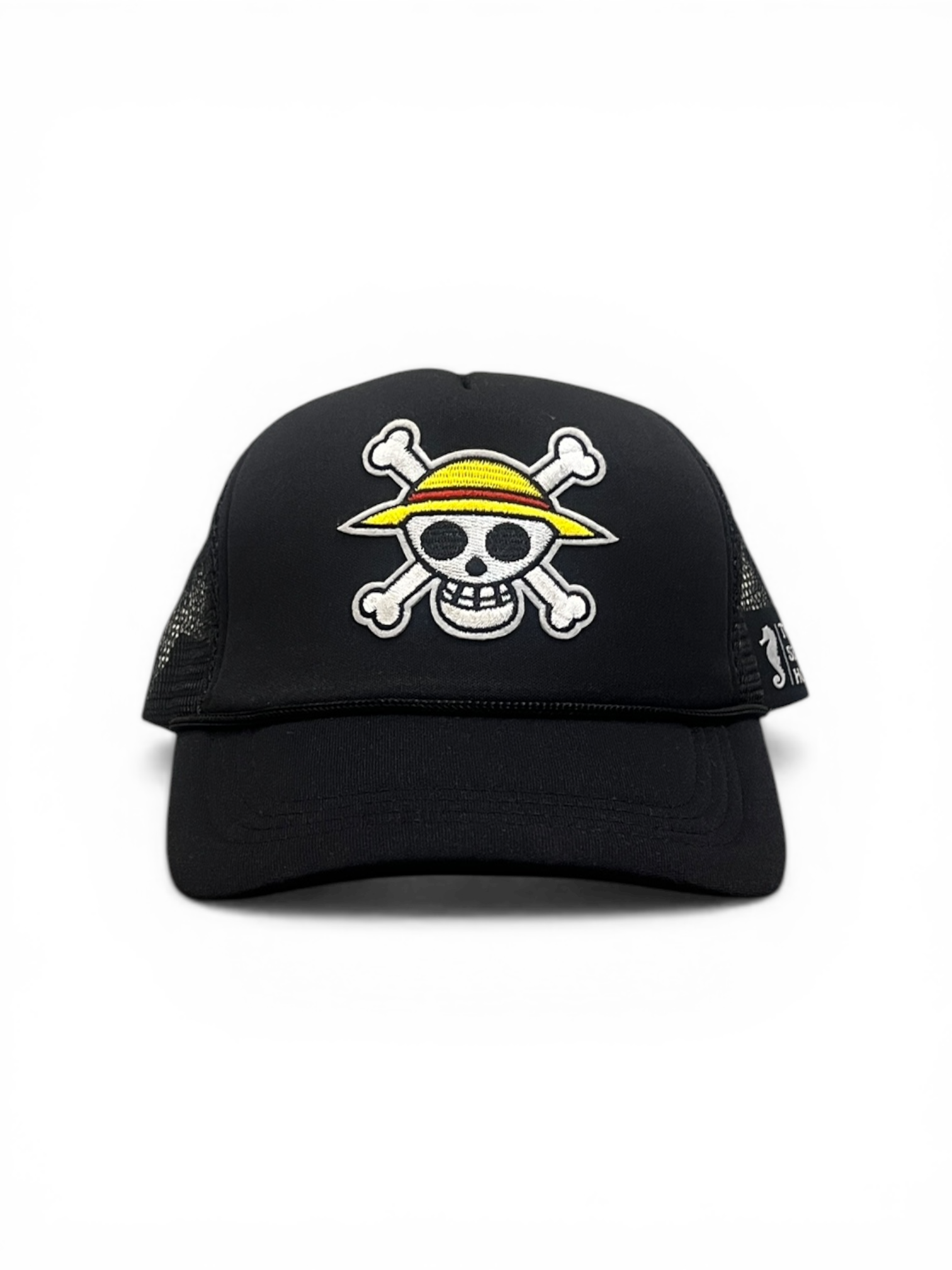 Black cap with a skull and crossbones design on a white background