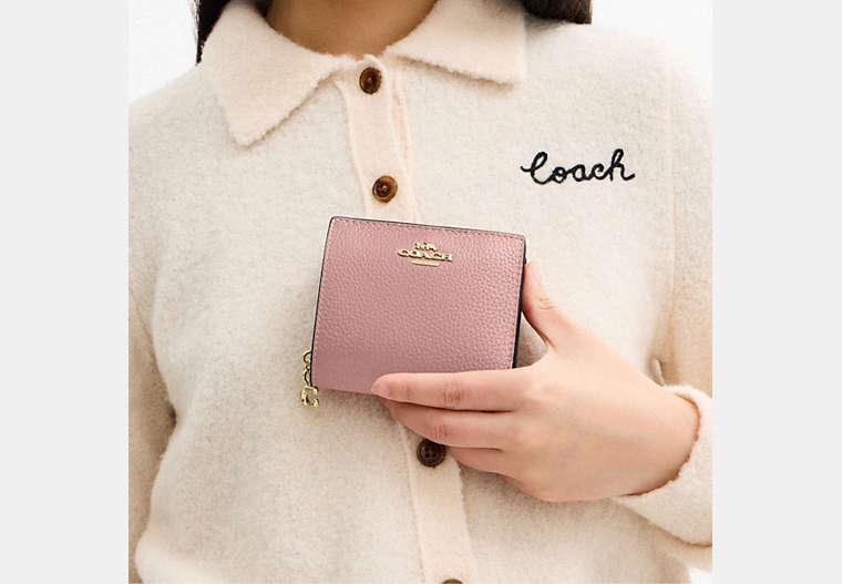 Snap Wallet In Signature Chenille - Gold/Carnation
