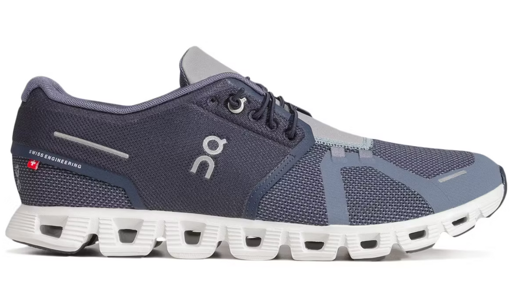 Navy and gray running shoe with white sole on a white background