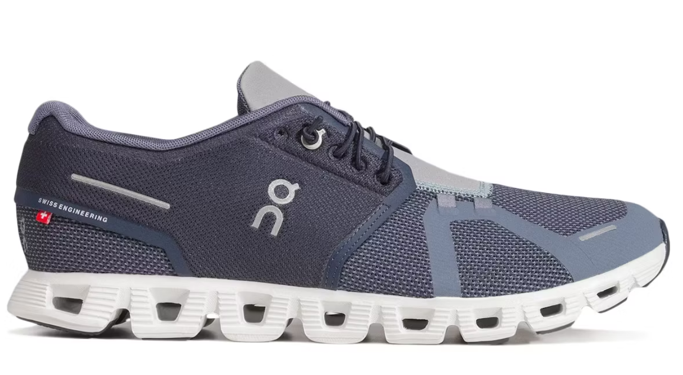 Navy and gray running shoe with white sole on a white background