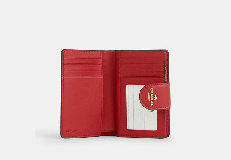 Medium Corner Zip Wallet In Signature Canvas - Gold/Crimson