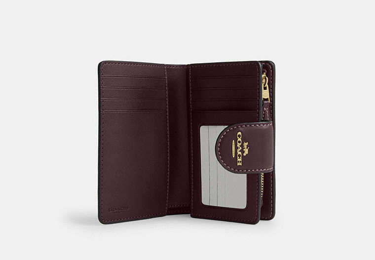 Medium Corner Zip Wallet In Signature Canvas - Gold/Black Currant