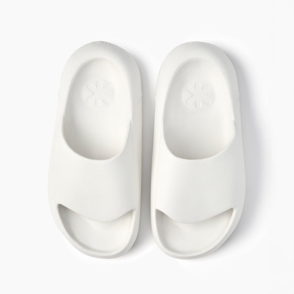 Ludic Sliders in white are designed for muscle recovery.	